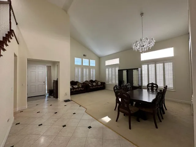 a dining room with furniture and window