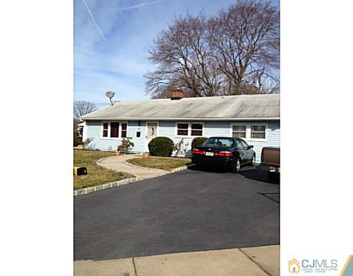 171 Winthrop Road Edison, NJ 08817 - Photo 1 of 13 a view of a car parked in front of a building
