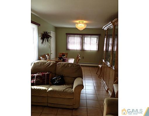 171 Winthrop Road Edison, NJ 08817 - Photo 5 of 13 a living room with furniture and a window