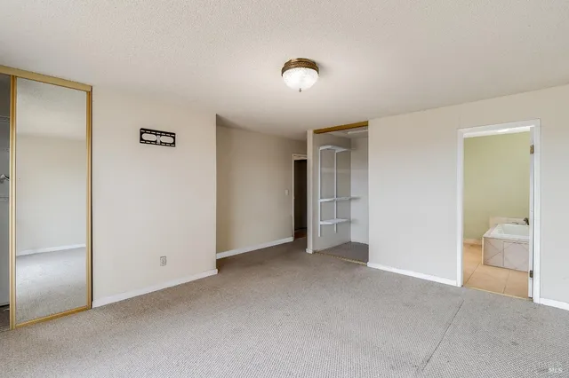 a view of a bathroom from a hallway