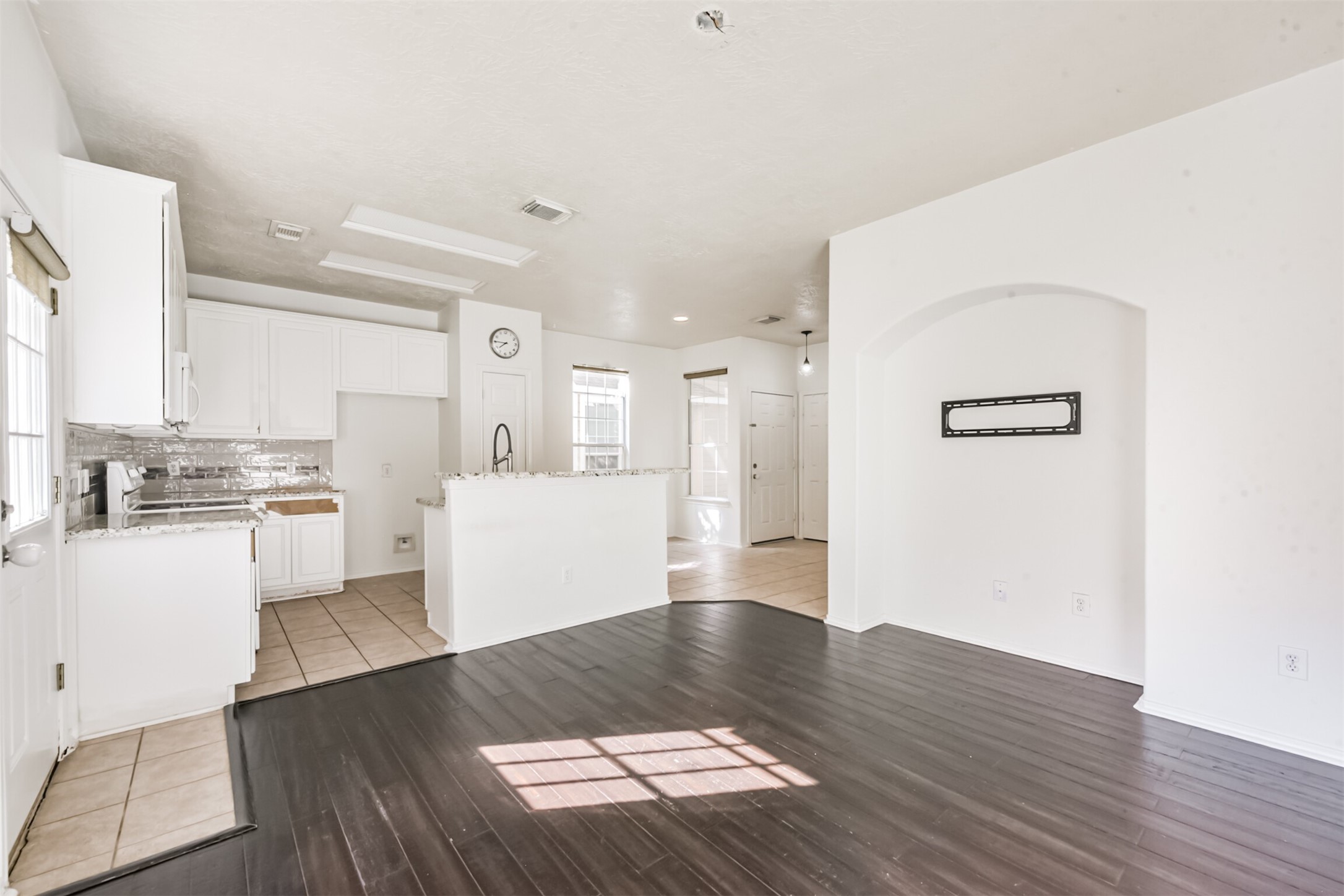 17538 Olympic Park Lane Humble, TX 77346 - Photo 5 of 21 Engineered wood flooring in Living Room. Cabinets have been repaired!