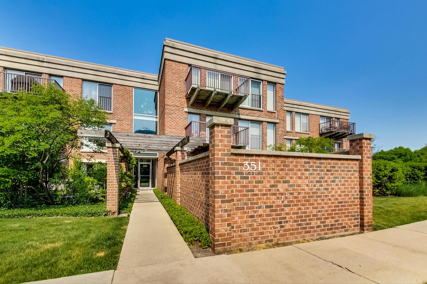 351 Kelburn Road, Unit 213 Deerfield, IL 60015 - Photo 1 of 37 front view of a house with a yard