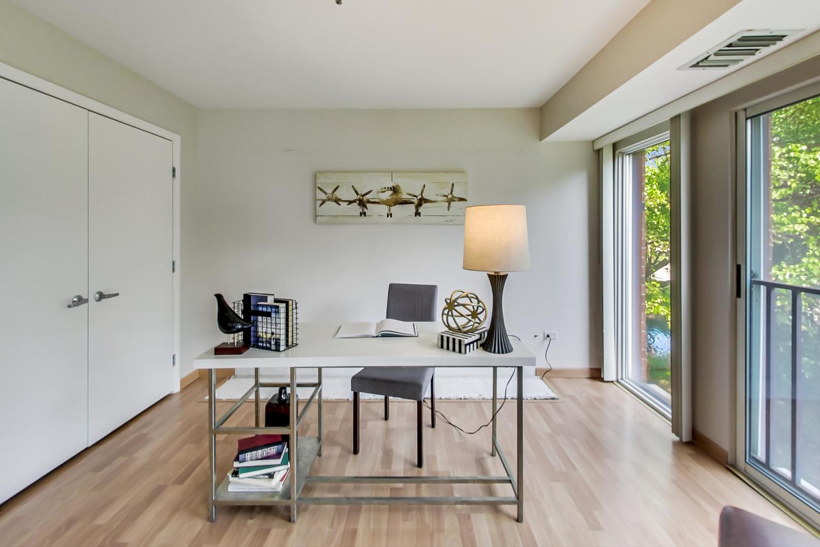 351 Kelburn Road, Unit 213 Deerfield, IL 60015 - Photo 14 of 37 a view of a workspace with furniture and a table