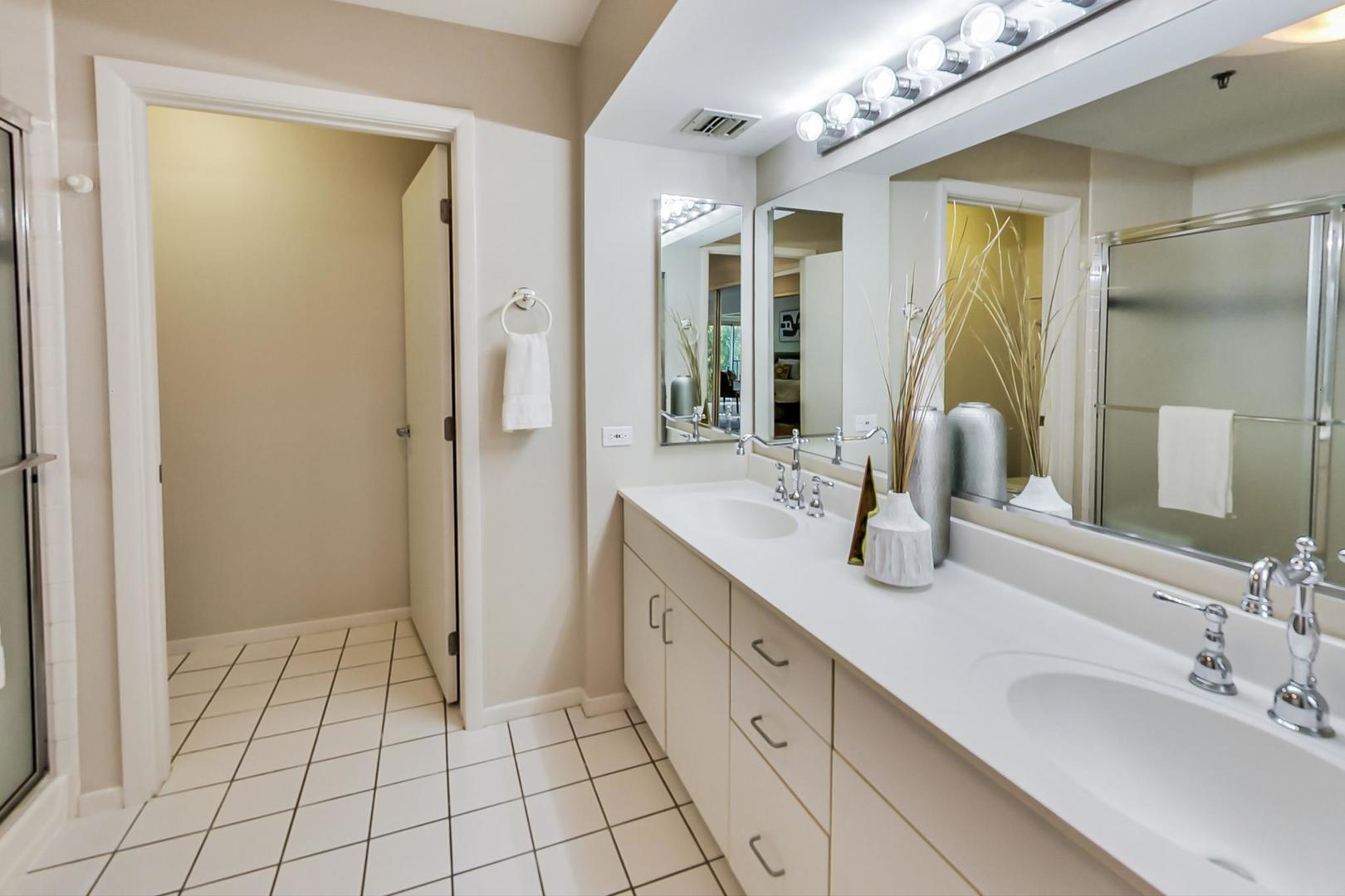 351 Kelburn Road, Unit 213 Deerfield, IL 60015 - Photo 17 of 37 a spacious bathroom with a double vanity sink and a mirror