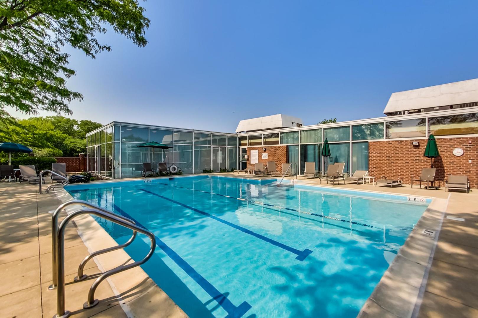 351 Kelburn Road, Unit 213 Deerfield, IL 60015 - Photo 34 of 37 a view of swimming pool with outdoor seating and yard