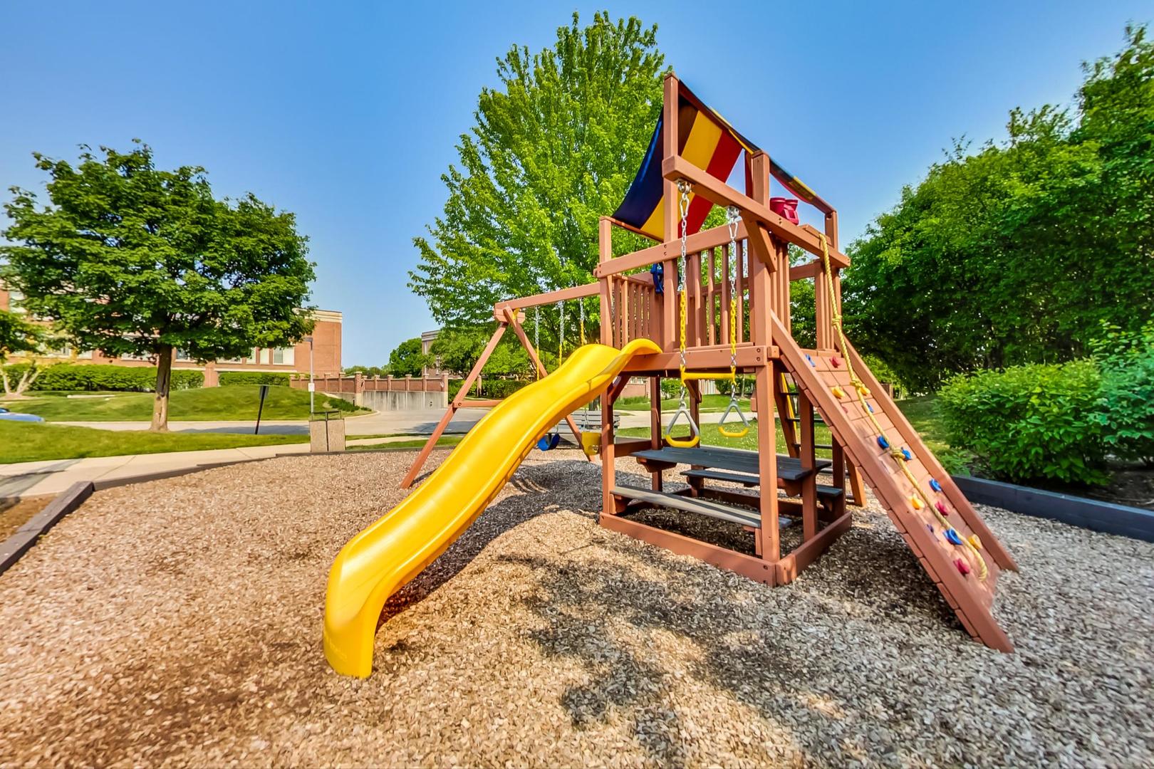 351 Kelburn Road, Unit 213 Deerfield, IL 60015 - Photo 37 of 37 a park with a bench and trees
