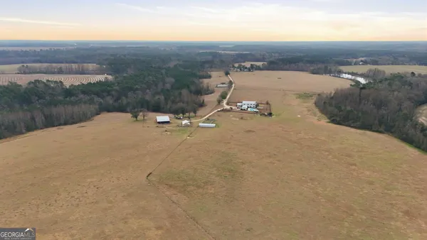 an aerial view of a house with outdoor space