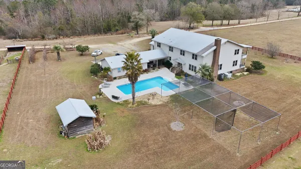 a view of a hallway with wooden floor and entryway