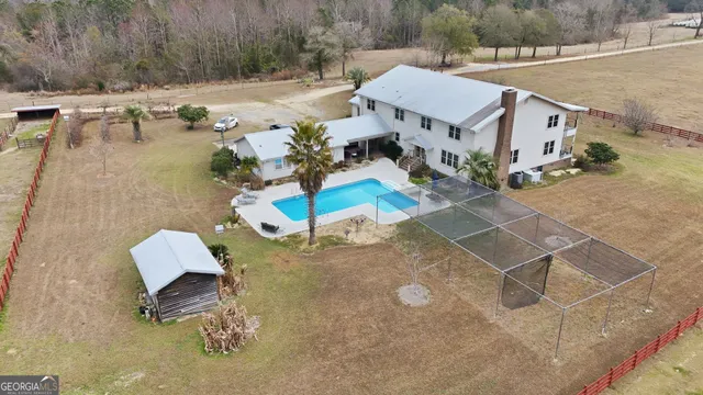 a view of a hallway with wooden floor and entryway