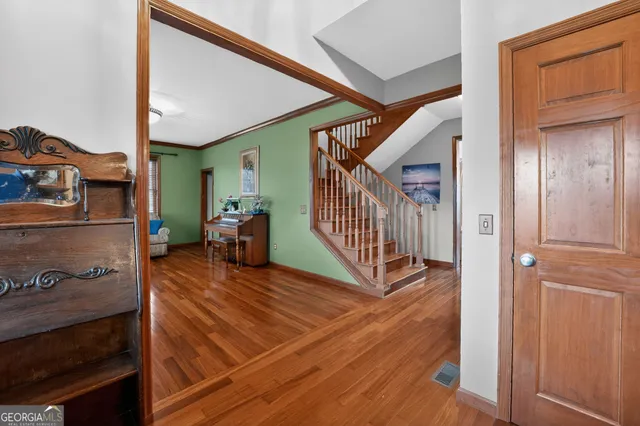 a view of a dining room with furniture and window