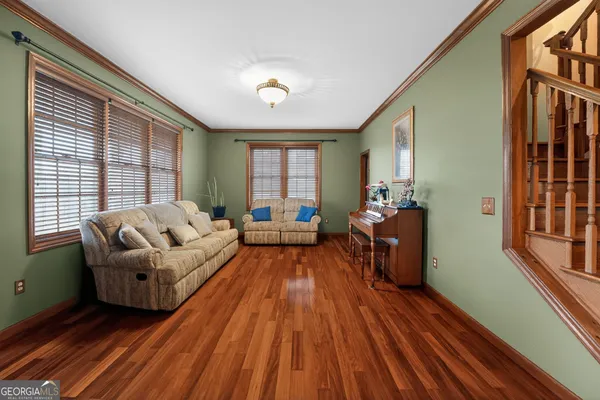 a view of a dining room with furniture window and wooden floor