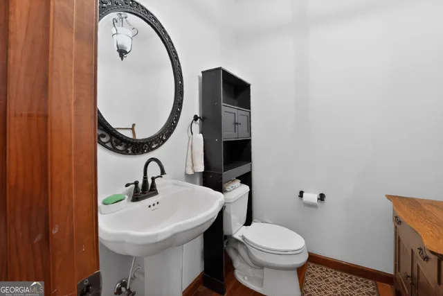 a kitchen with stainless steel appliances kitchen island granite countertop a stove and a sink