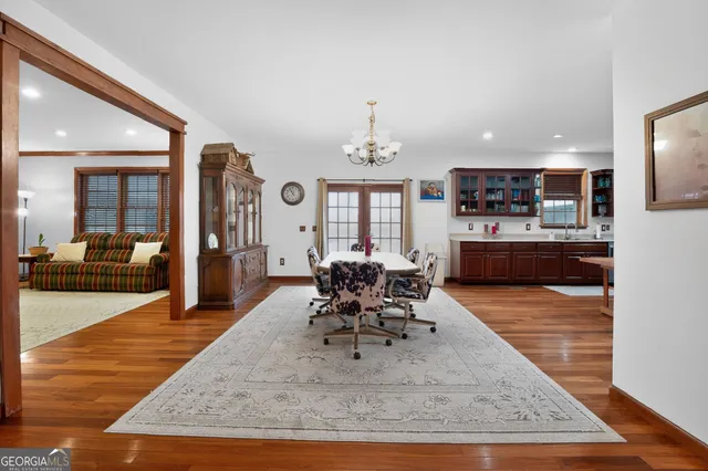 a living room with furniture ceiling fan and window