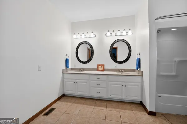 a room with furniture a air conditioner and a window