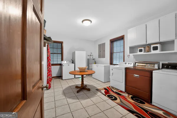 a view of a porch with wooden floor and windows