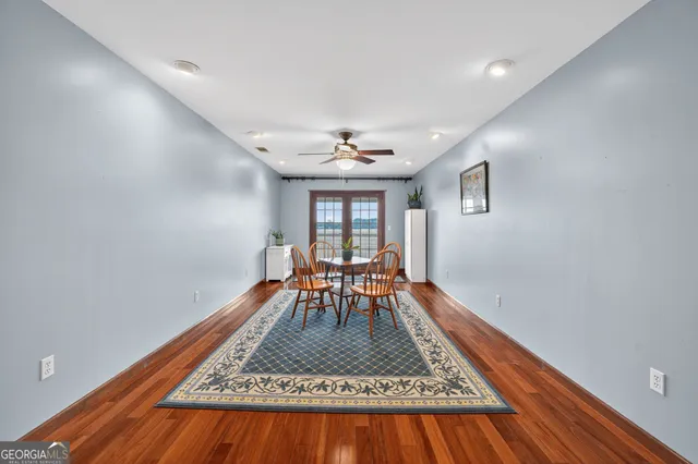 a bed sitting in a bedroom next to a window