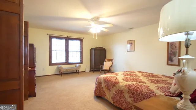 a spacious bathroom with a double vanity sink and a mirror
