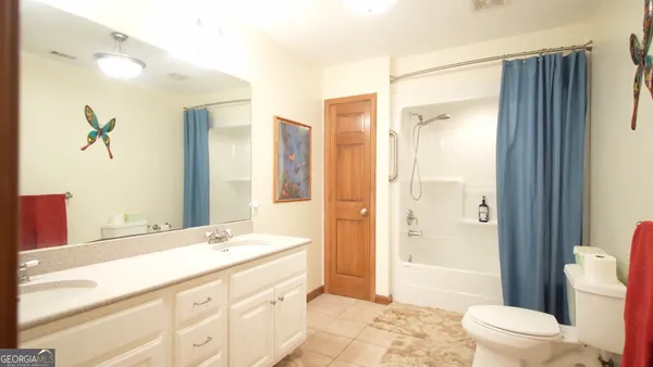 a bathroom with a glass shower door