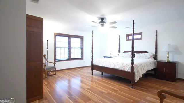 a bedroom with furniture and a chandelier