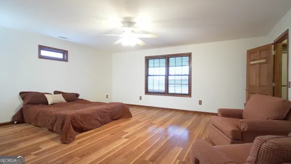 a view of a dining room with furniture and a chandelier