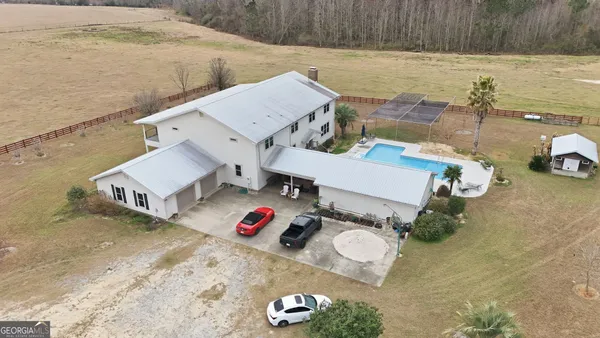 a view of house with outdoor space and sitting area