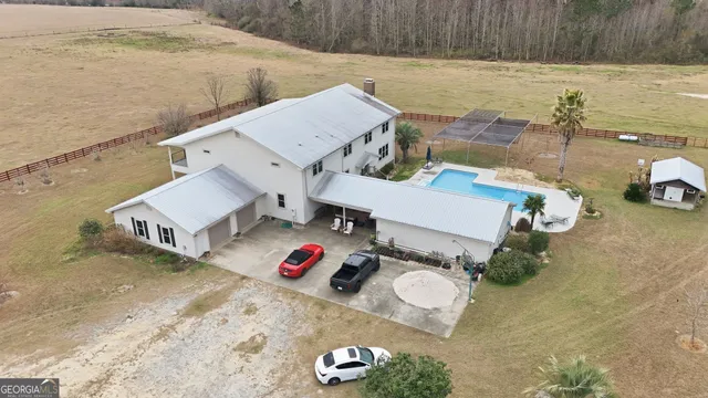 a view of house with outdoor space and sitting area