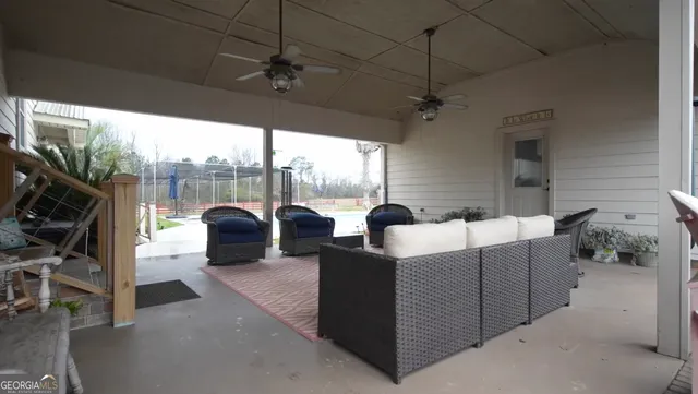 a view of a swimming pool and a yard