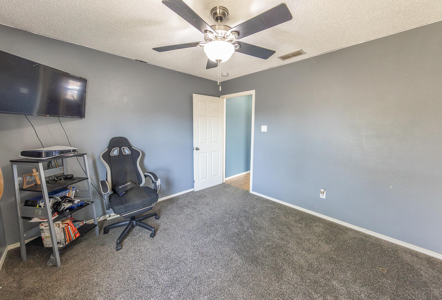 6901 9th Street Lubbock, TX 79416 - Photo 14 of 27 a view of a room with gym equipment