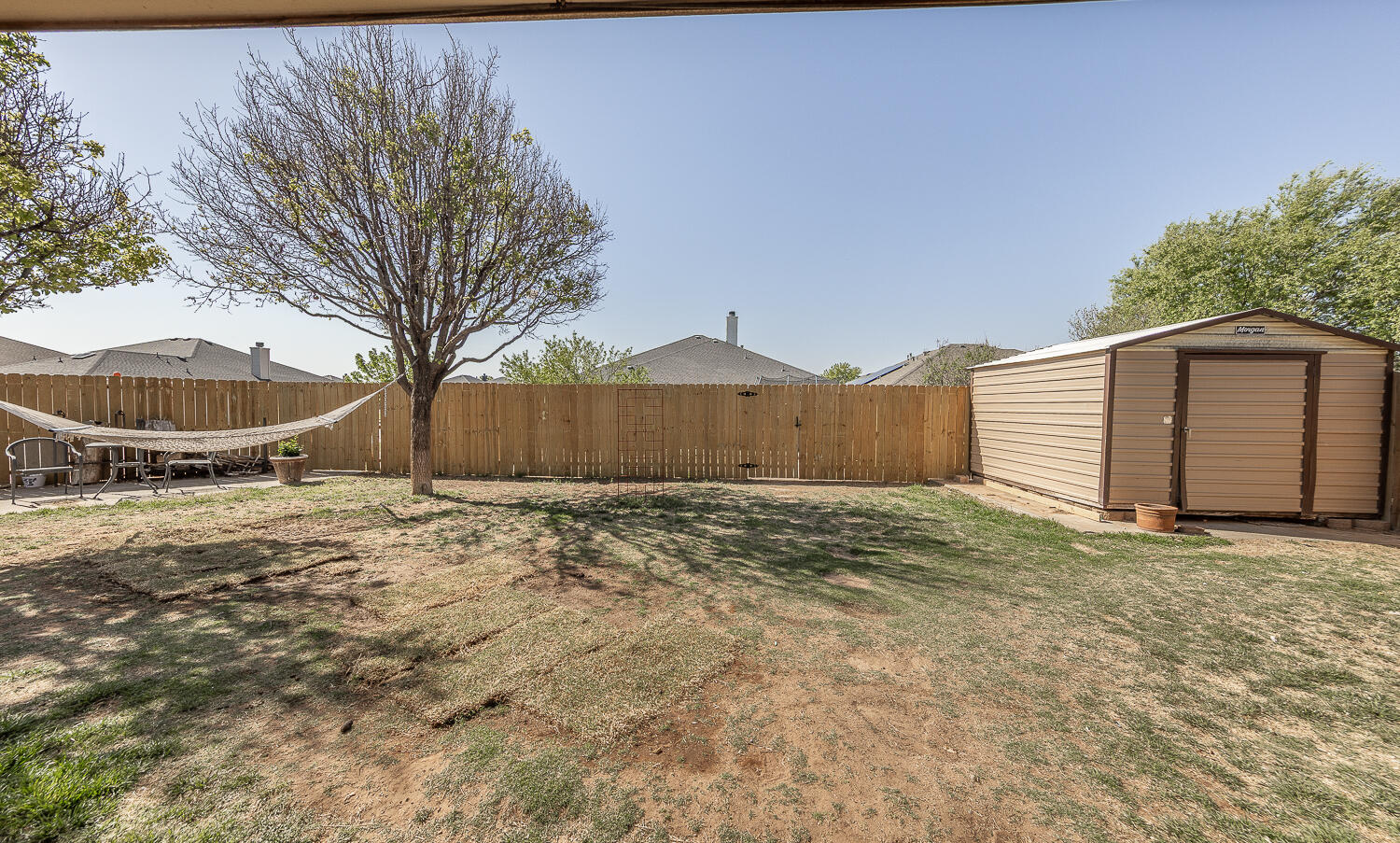 6901 9th Street Lubbock, TX 79416 - Photo 15 of 27 a view of a backyard of a house