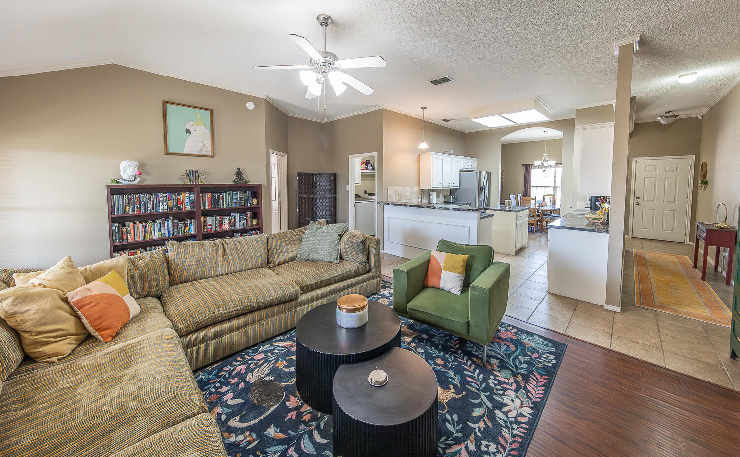 6901 9th Street Lubbock, TX 79416 - Photo 2 of 27 a living room with furniture and a wooden floor