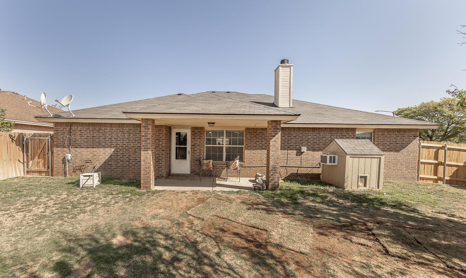6901 9th Street Lubbock, TX 79416 - Photo 21 of 27 a front view of a house with a yard