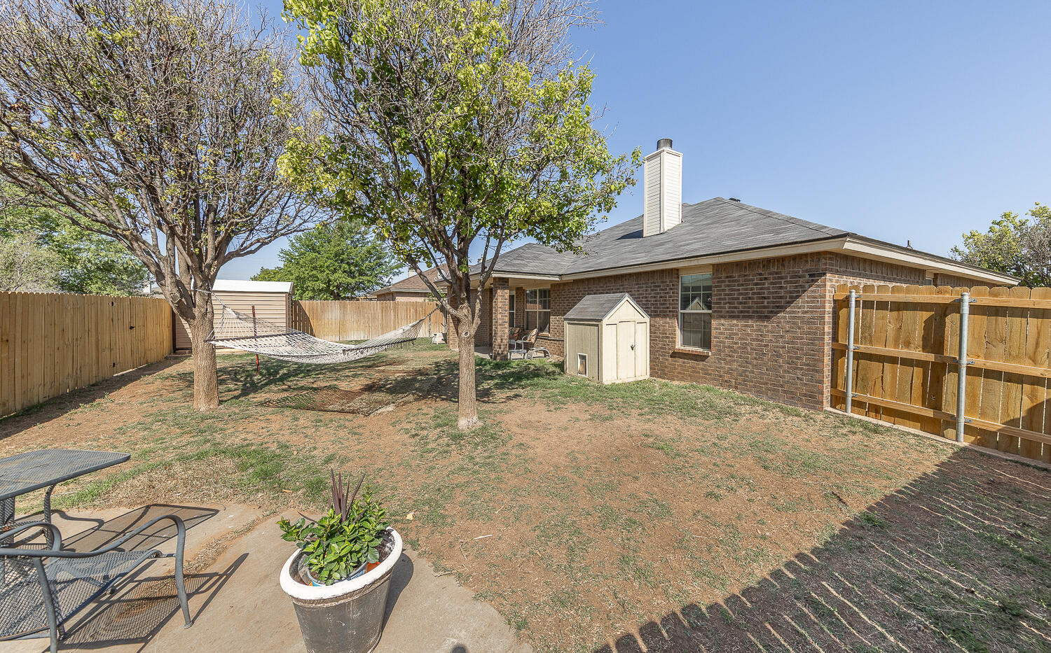 6901 9th Street Lubbock, TX 79416 - Photo 24 of 27 a front view of a house with a yard