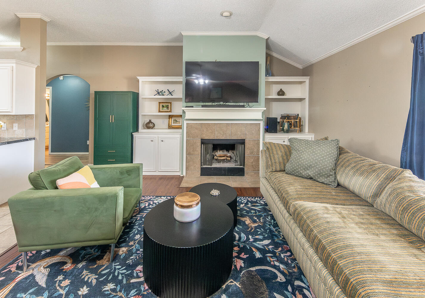 6901 9th Street Lubbock, TX 79416 - Photo 5 of 27 a living room with furniture and a fireplace