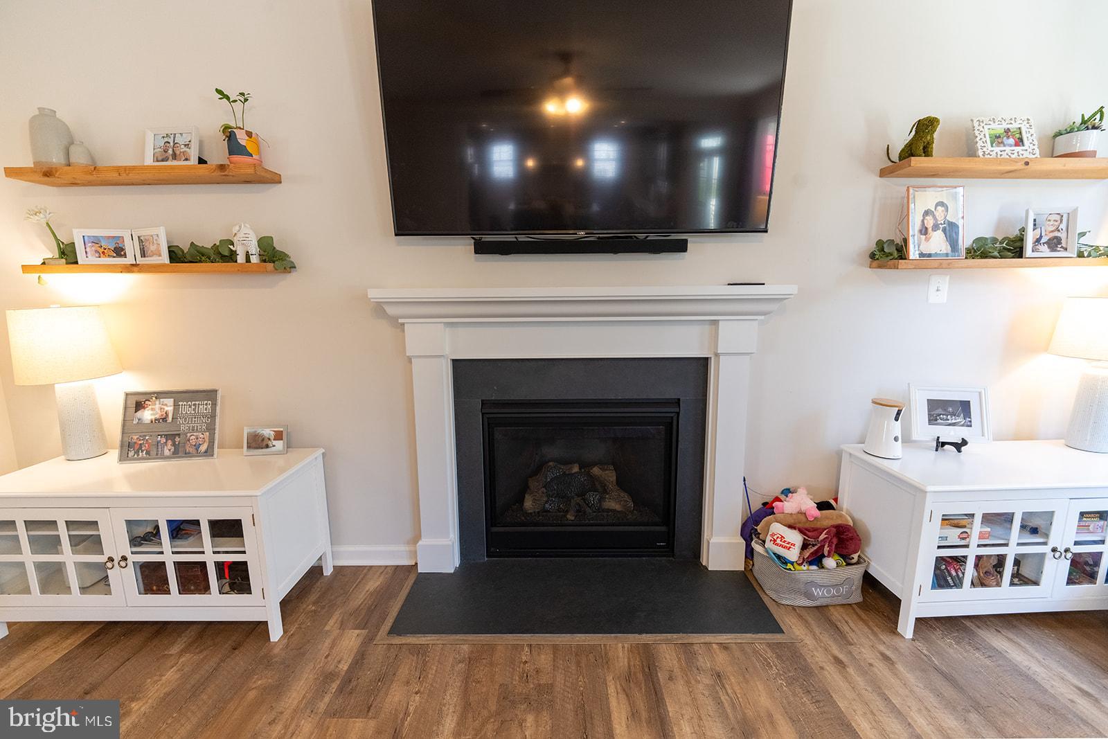 43907 Monterey Street California, MD 20619 - Photo 21 of 95 a living room with furniture and a fireplace