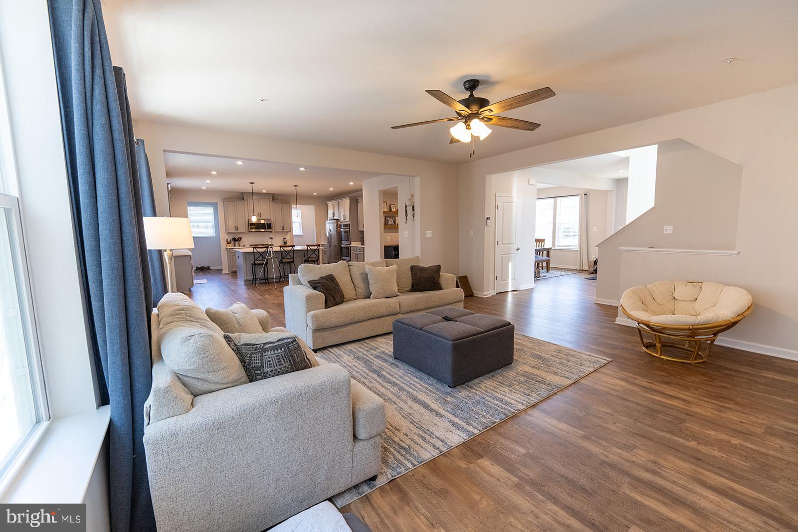 43907 Monterey Street California, MD 20619 - Photo 22 of 95 a living room with furniture a chandelier and a rug