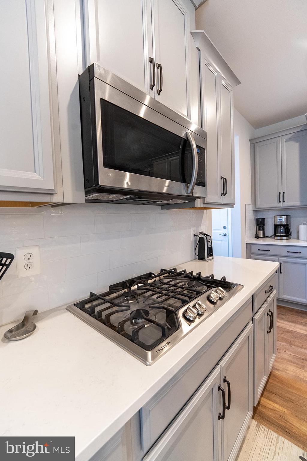 43907 Monterey Street California, MD 20619 - Photo 30 of 95 a kitchen with stainless steel appliances a sink a stove and microwave