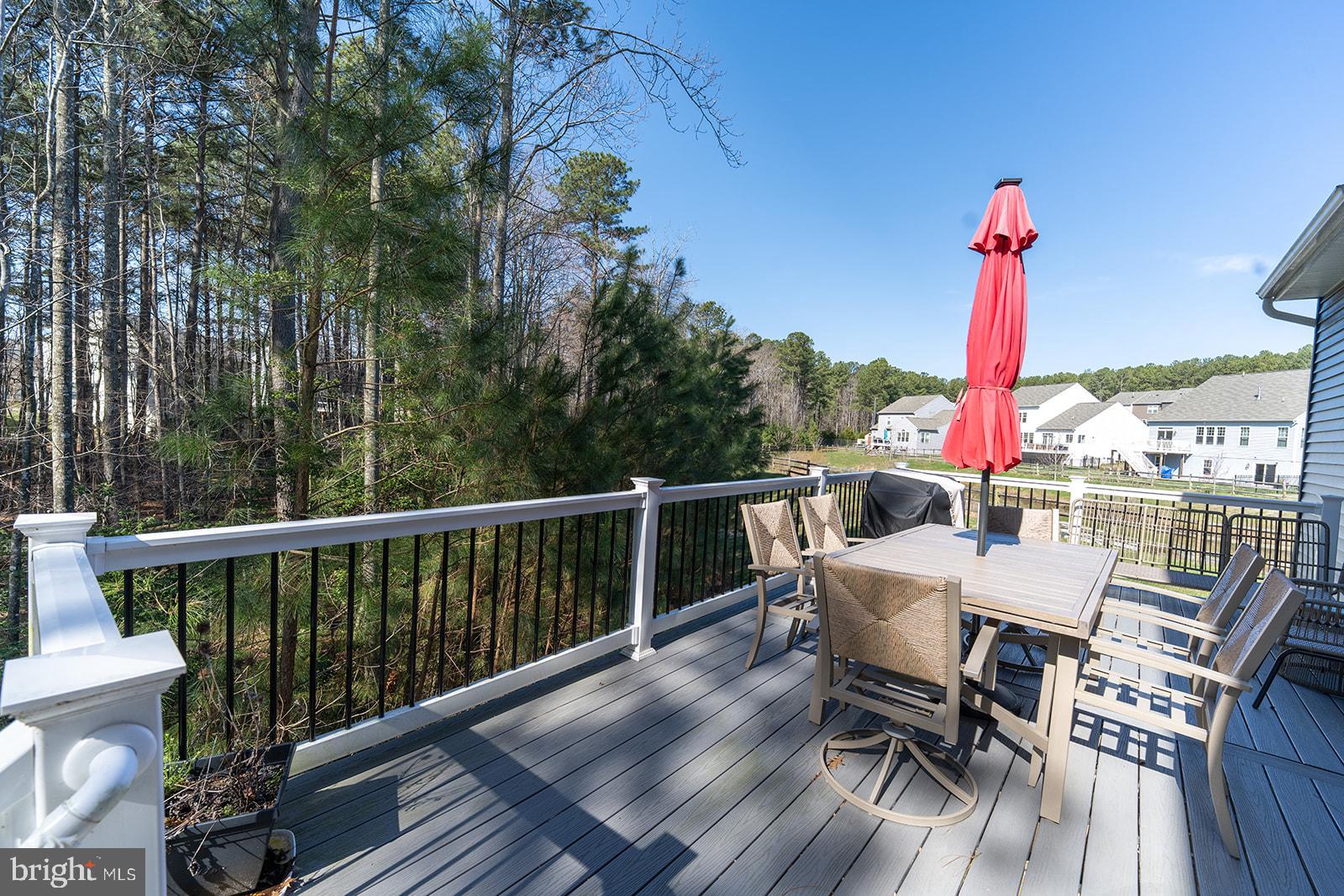 43907 Monterey Street California, MD 20619 - Photo 37 of 95 a view of a dining tables and chairs on the roof deck