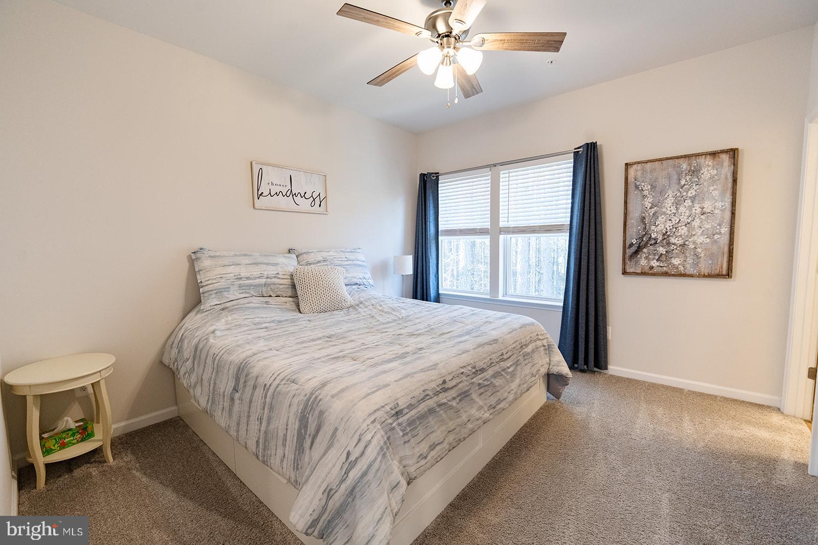 43907 Monterey Street California, MD 20619 - Photo 39 of 95 a bedroom with a large bed and a window