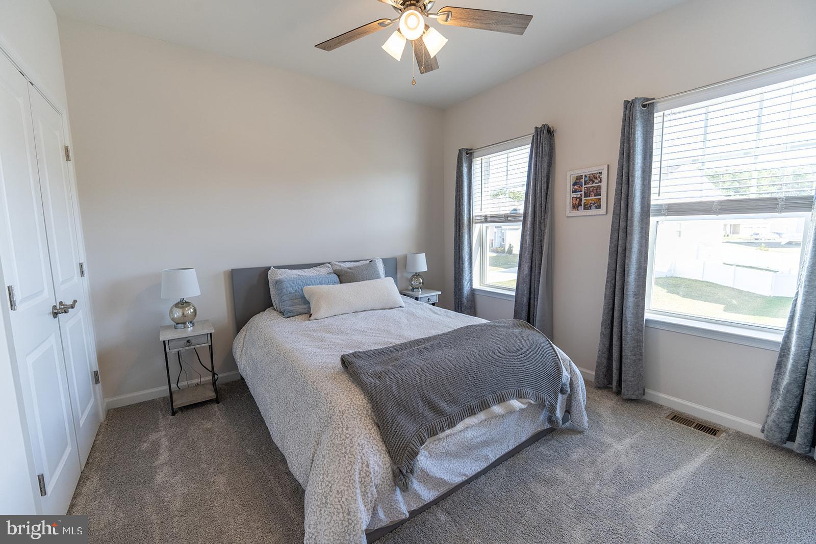 43907 Monterey Street California, MD 20619 - Photo 47 of 95 a bedroom with a bed and a chandelier