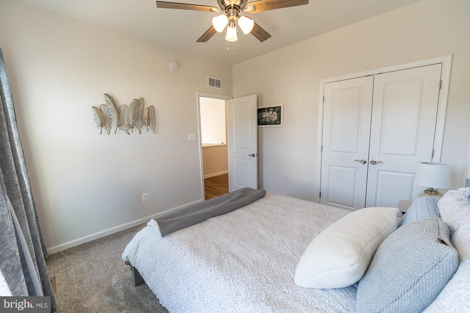 43907 Monterey Street California, MD 20619 - Photo 48 of 95 a bedroom with a bed and a chandelier