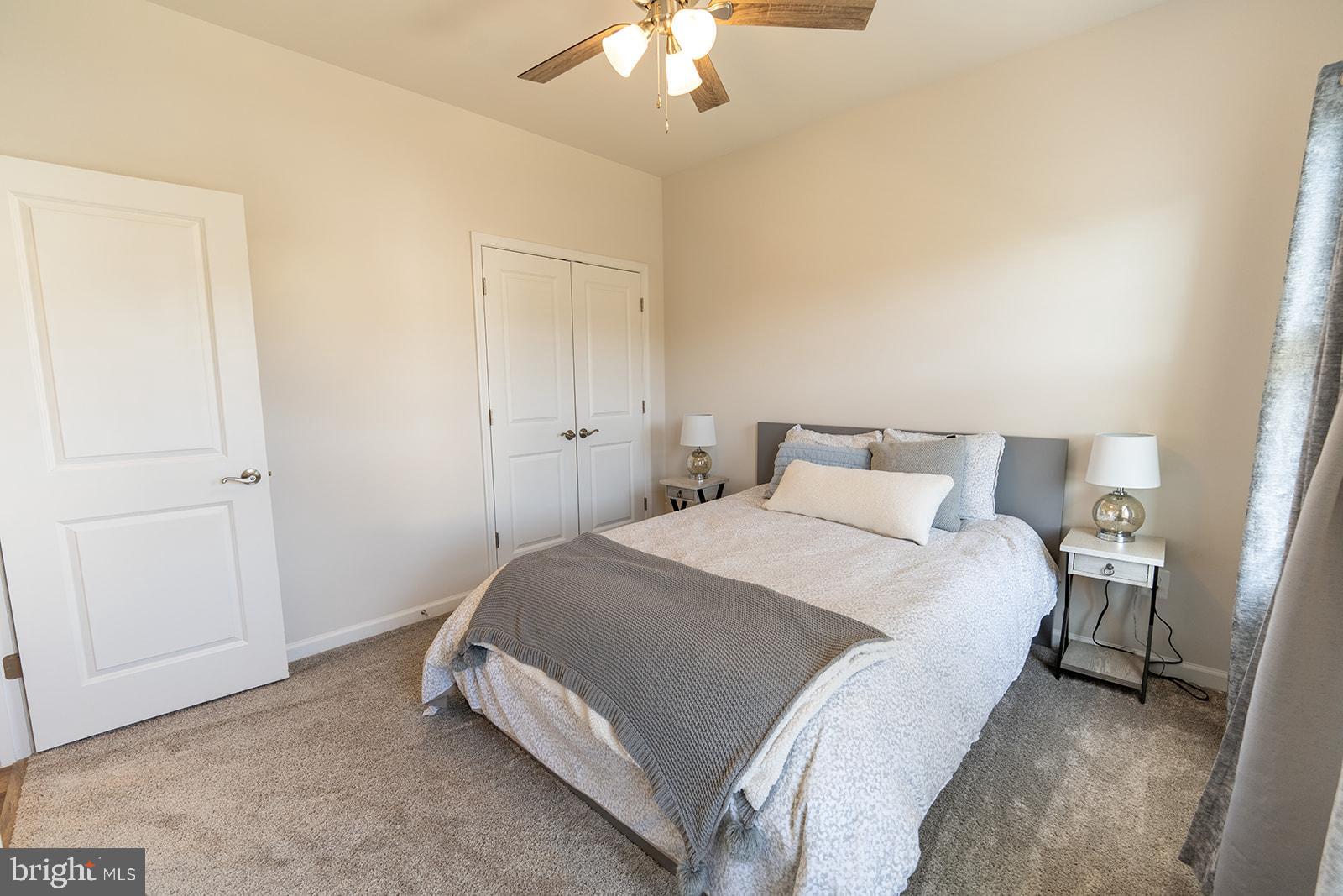 43907 Monterey Street California, MD 20619 - Photo 49 of 95 a bedroom with a bed and a chandelier