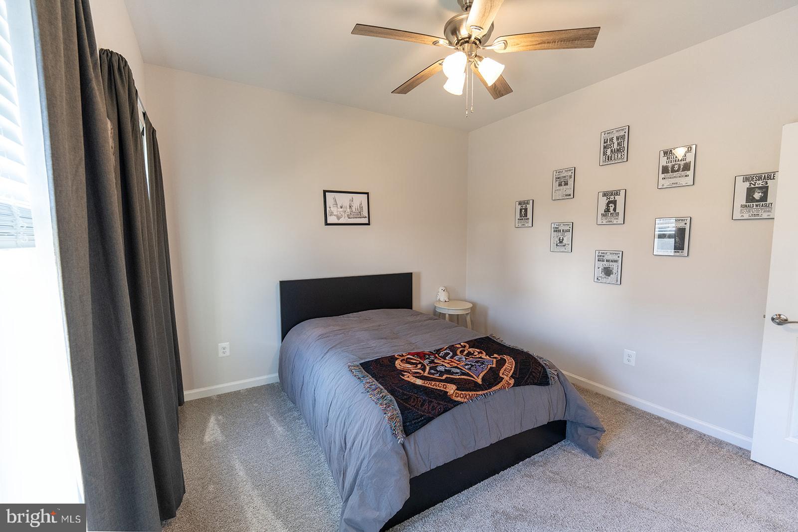 43907 Monterey Street California, MD 20619 - Photo 51 of 95 a bedroom with a bed and a chandelier