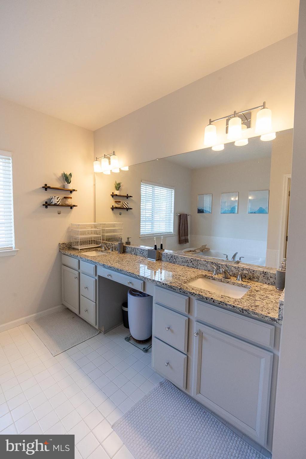 43907 Monterey Street California, MD 20619 - Photo 63 of 95 a bathroom with a granite countertop sink and a mirror