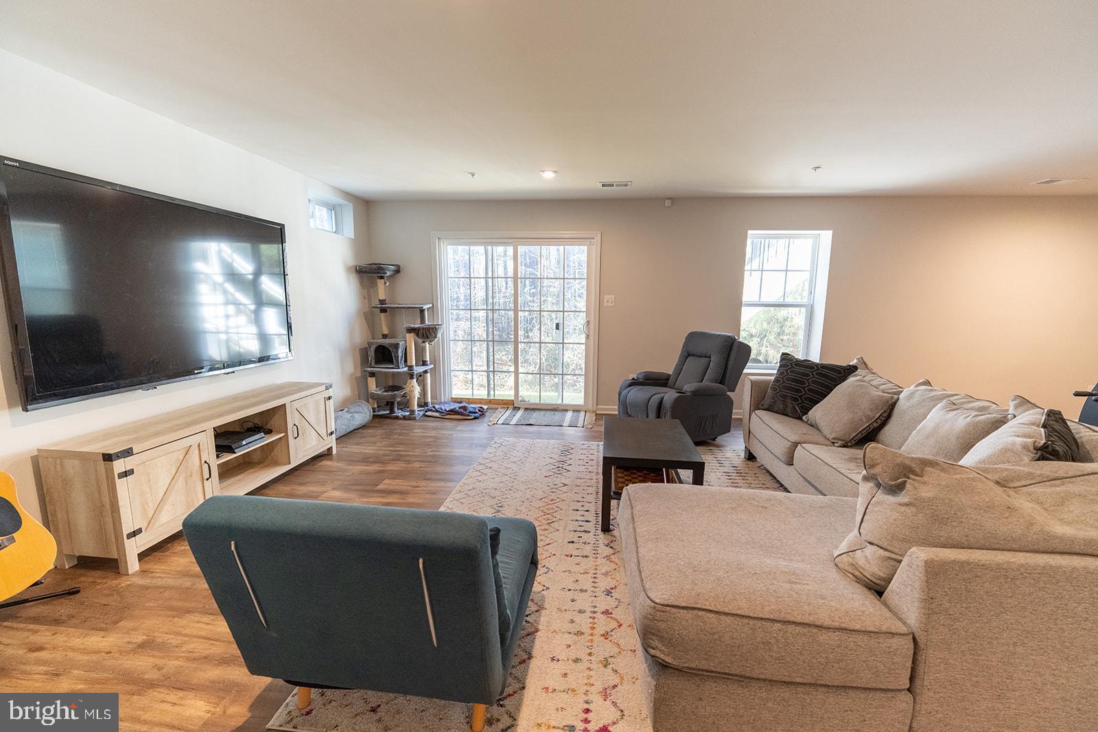 43907 Monterey Street California, MD 20619 - Photo 77 of 95 a living room with furniture and a flat screen tv
