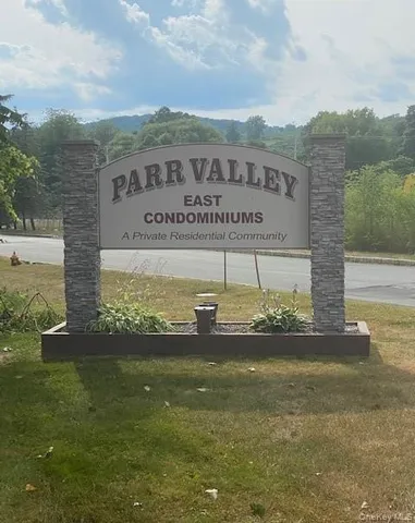 a view of a garden with a building in the background