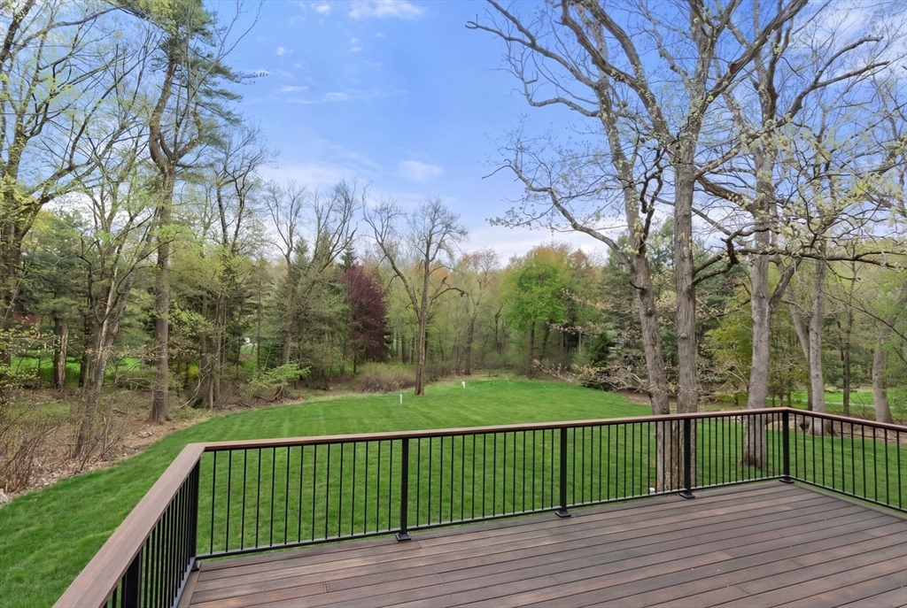 82 Deer Path Lane Weston, MA 02493 - Photo 39 of 42 a view of a balcony with wooden fence