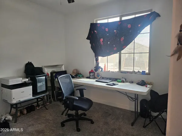 a room with a chair and a window