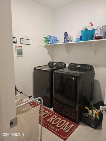 a utility room with dryer and washer