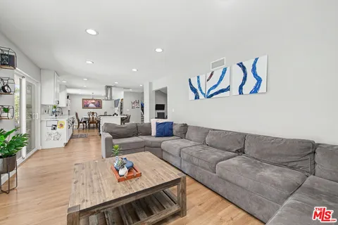 a play room with furniture and a wooden floor