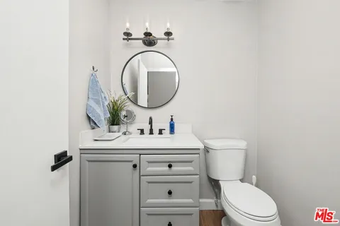 a bedroom with a bed and a chair